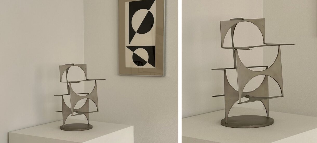 L-G Nordström sculpture and abstract artpiece in black and white hanging on the wall behind the sculpture. Also a close up of the sculpture