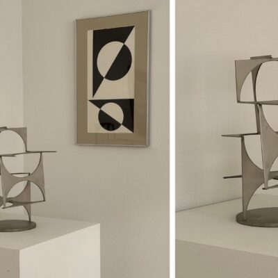 L-G Nordström sculpture and abstract artpiece in black and white hanging on the wall behind the sculpture. Also a close up of the sculpture